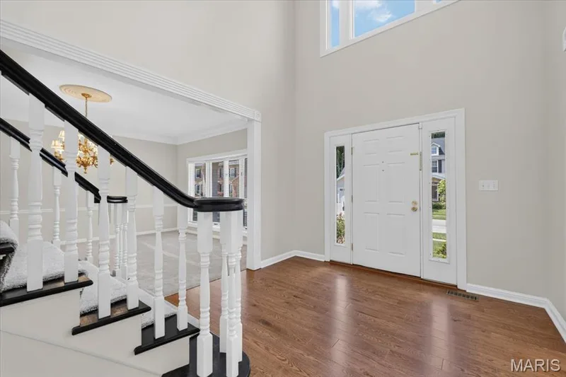 Two-story entryway featuring wood-finish flooring — 16557 Baxter Forest Ridge Drive, Chesterfield, MO 63005