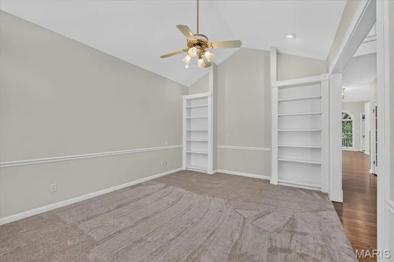 Lovely living area with built in bookshelves — 16557 Baxter Forest Ridge Drive, Chesterfield, MO 63005