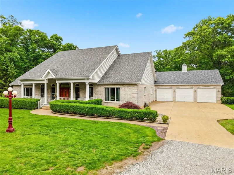 Garage has 8 ft tall doors, 11 ft tall ceilings, 24 feet deep, 48 feet wide, — 64 Dumont Court, Foristell, MO 63348