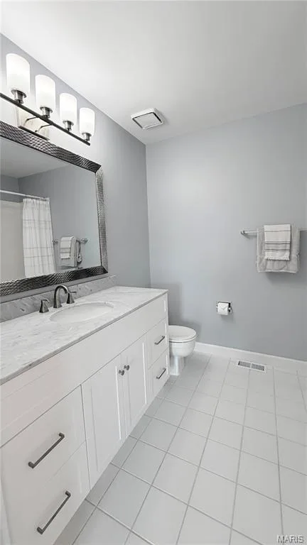White shaker-style vanity with a light-toned countertop and integrated sink — 2154 White Lane Drive, Chesterfield, MO 63017