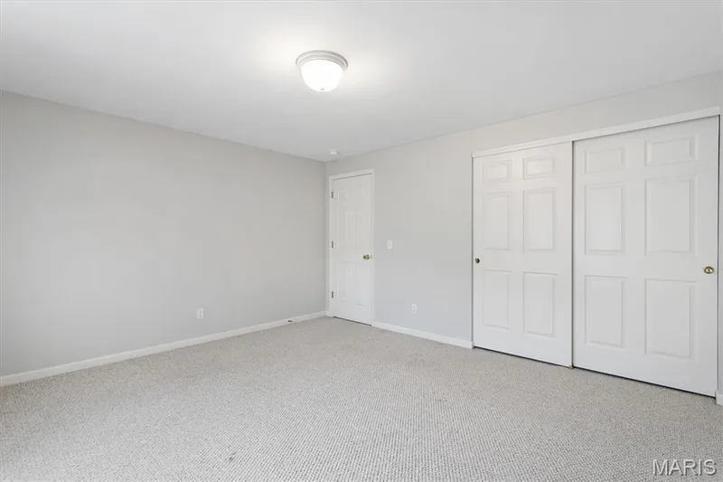 Private lower level bedroom has double-door closet. — 6 Country Bluff Court, St Charles, MO 63301