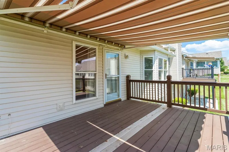 Ahhh, the shade of the deck awning to enjoy the summer. — 6 Country Bluff Court, St Charles, MO 63301