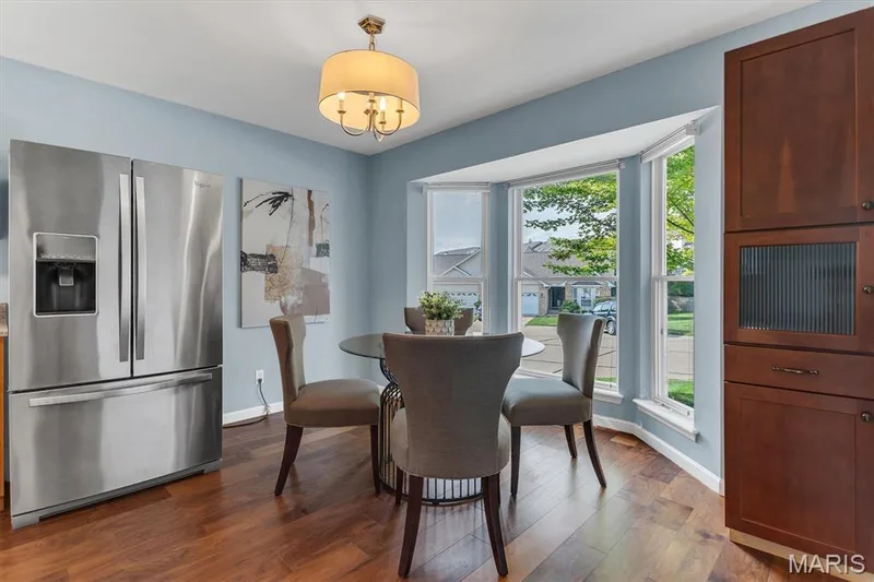Kitchen opens to breakfast room with bay window. Refrigerator stays. — 6 Country Bluff Court, St Charles, MO 63301