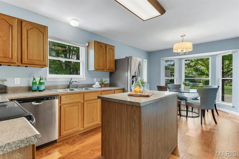 Kitchen has center island and breakfast room — 6 Country Bluff Court, St Charles, MO 63301