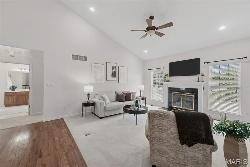 Living room with cozy gas fireplace (Looking into hall w 2 additional beds & bath) — 202 Highland Meadows Drive, Wentzville, MO 63385