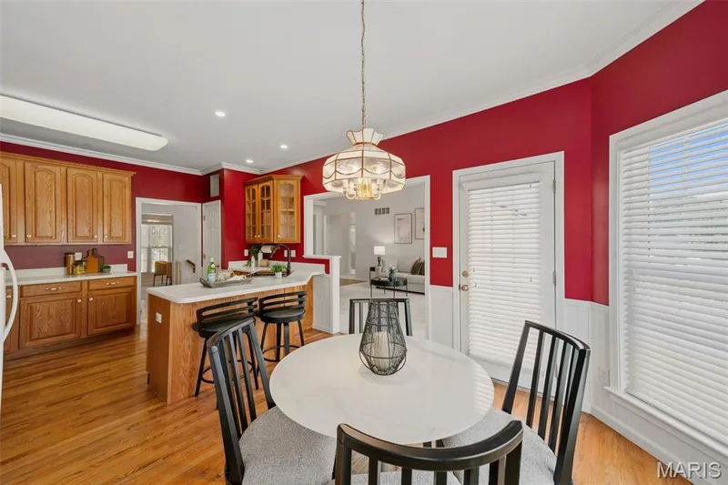 Breakfast bar & door to maintenance free deck off of kitchen — 202 Highland Meadows Drive, Wentzville, MO 63385