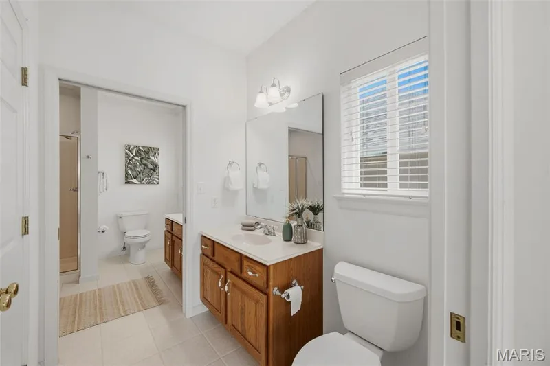 1/2 bath adjacent to 2nd bath on main level, complete with walk in closet — 202 Highland Meadows Drive, Wentzville, MO 63385