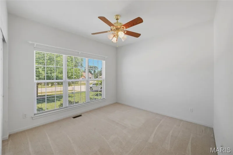 3rd bedroom on main level with lots of windows & large closet — 202 Highland Meadows Drive, Wentzville, MO 63385
