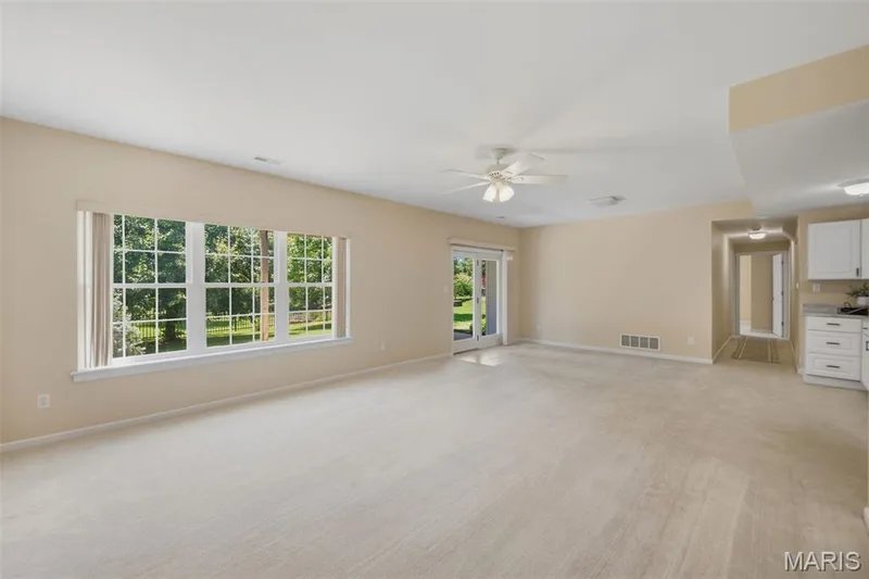 Lower level family room with walk out to patio — 202 Highland Meadows Drive, Wentzville, MO 63385