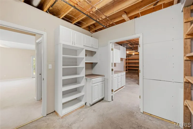 1 of 2 entrances to storage areas & work/hobby area in lower level — 202 Highland Meadows Drive, Wentzville, MO 63385