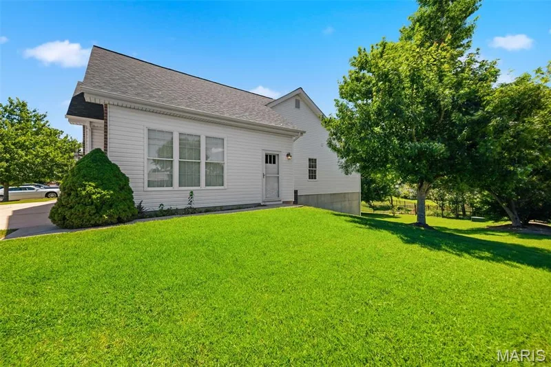 Side door to single car side of garage - convenient & energy efficient! — 202 Highland Meadows Drive, Wentzville, MO 63385