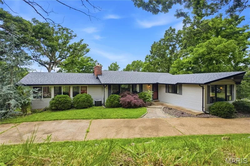 Ranch-style residence featuring light-colored siding and a dark shingle roof — 1221 Shepard Road, Wildwood, MO 63038
