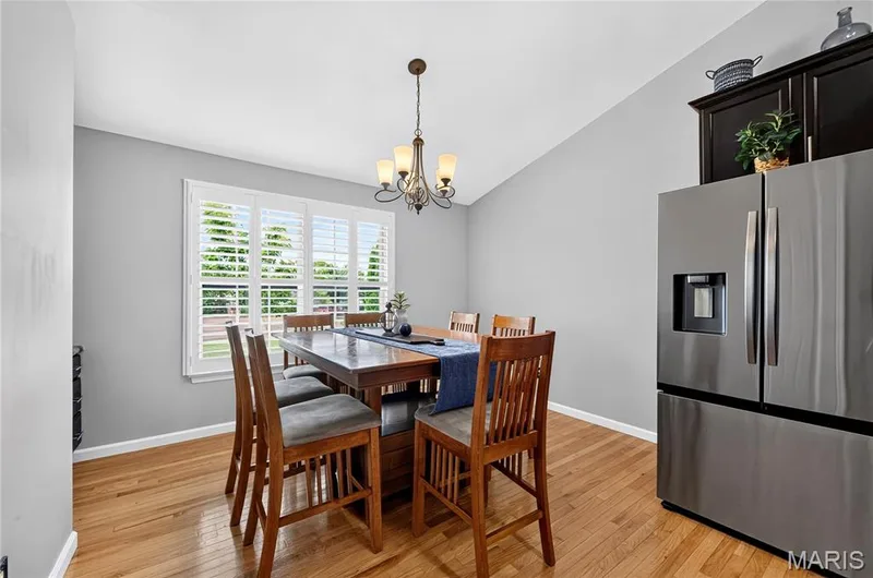 Dining space featuring hardwood flooring — 708 Bellingrath Gardens Court, Wentzville, MO 63385