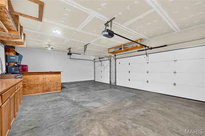 dry walled and insulated, insulated garage doors — 708 Bellingrath Gardens Court, Wentzville, MO 63385