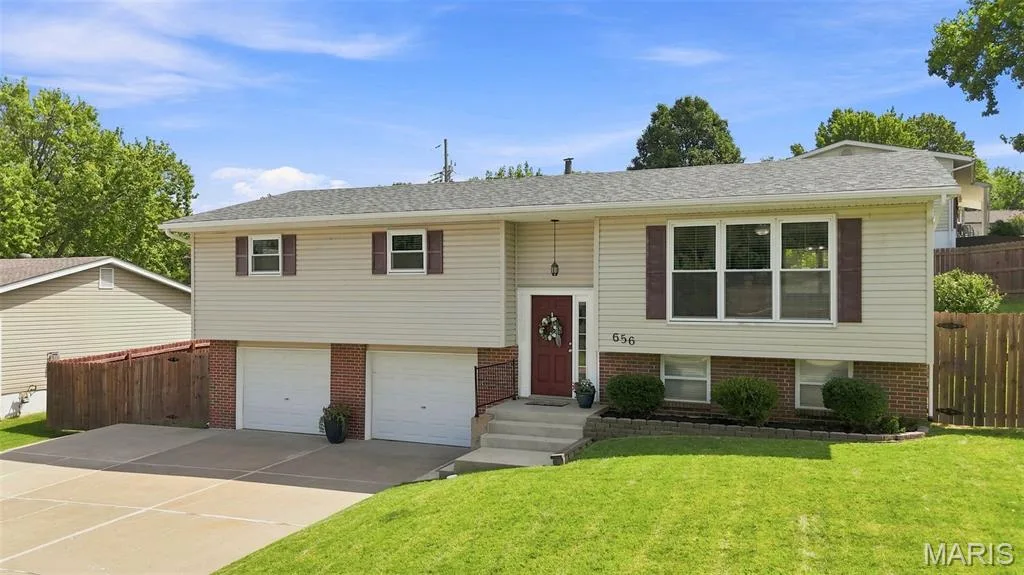 Welcome to 656 Nancy Drive, a beautiful split foyer home on a large corner lot with a two-car true oversized garage and an entire extra parking lane. — 656 Nancy Drive, St Charles, MO 63301