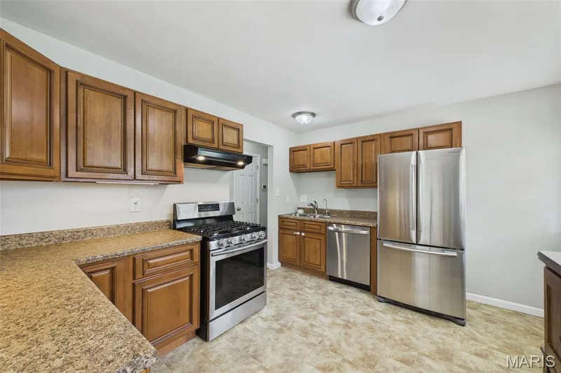 The large, eat-in sized kitchen has plenty of cabinets and countertop space — 656 Nancy Drive, St Charles, MO 63301