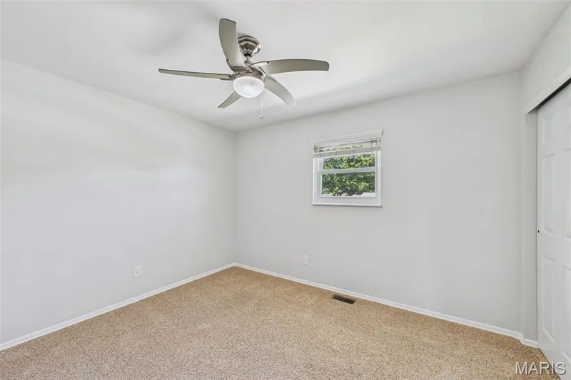 Secondary bedroom with a custom closet — 656 Nancy Drive, St Charles, MO 63301