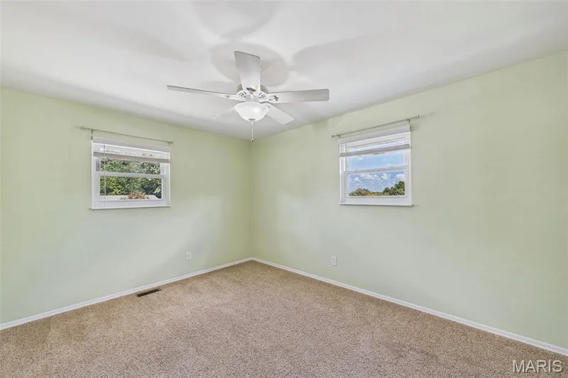 Secondary bedroom with a custom closet — 656 Nancy Drive, St Charles, MO 63301