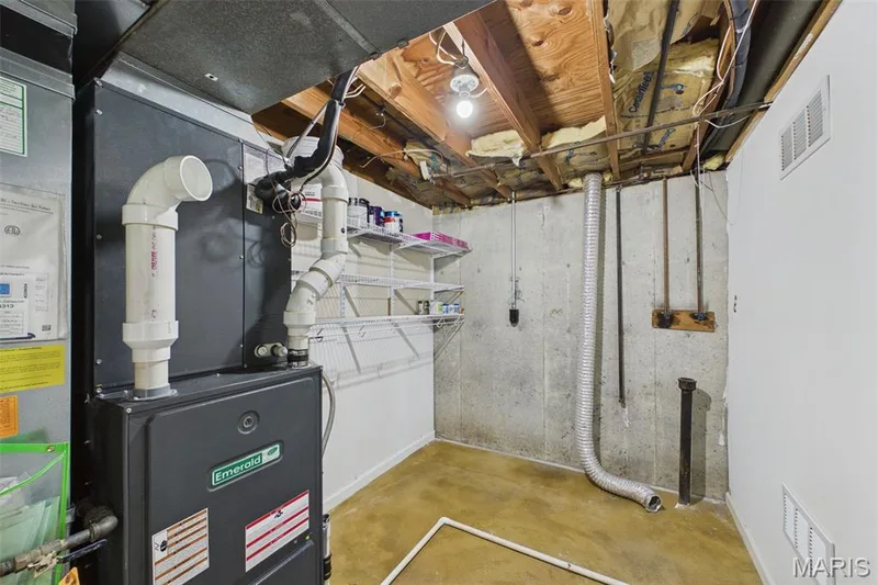 The HVAC and lower level laundry has built-in storage shelves — 656 Nancy Drive, St Charles, MO 63301