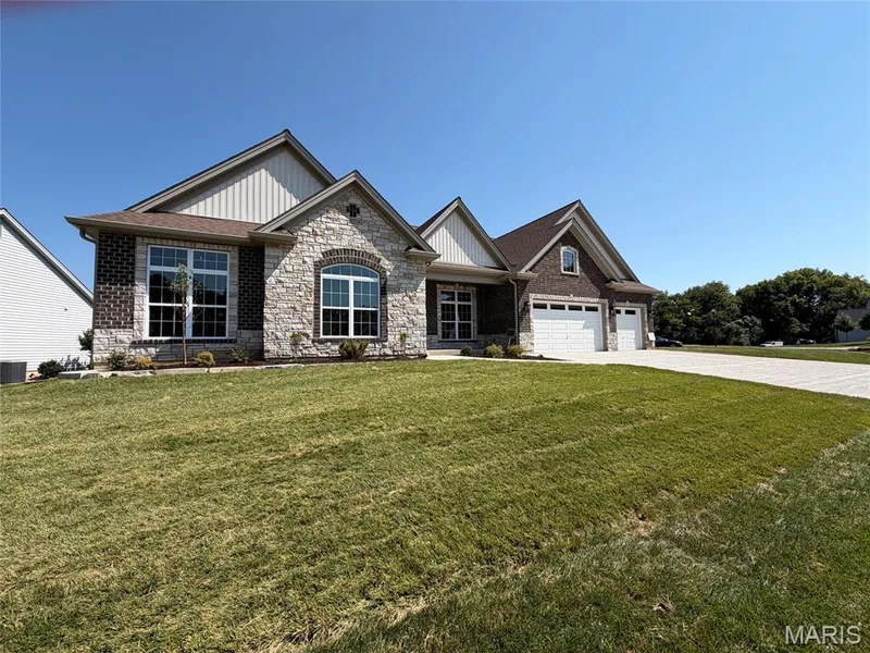 Stone and brick exterior with multiple gables — Lot 27 Bellevaux Place, St Charles, MO 63301