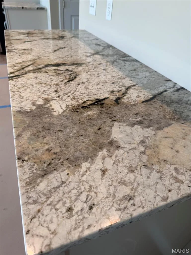 Polished stone countertop with intricate veining — Lot 27 Bellevaux Place, St Charles, MO 63301