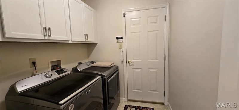 Main floor laundry w stainless washer and dryer 2025 replaced stay w home.  Cabinets in laundry replaced in 2025 — 30 Sterling Pointe Drive #22A, St Charles, MO 63301