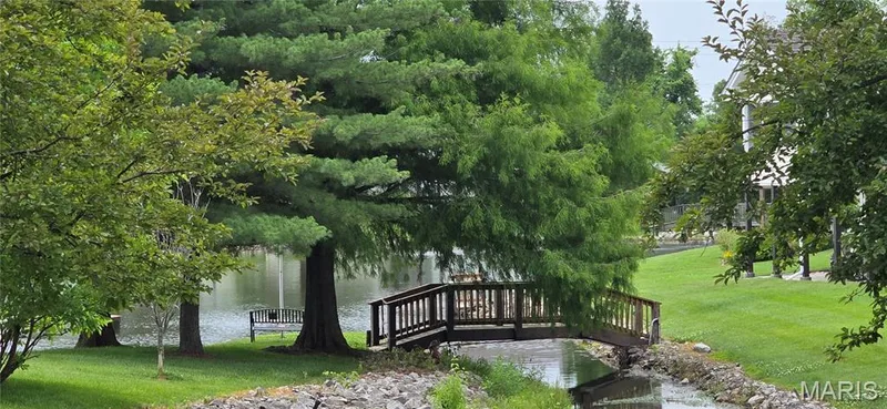 Lovely lake with fountain, bridge and bench for you to enjoy. — 30 Sterling Pointe Drive #22A, St Charles, MO 63301