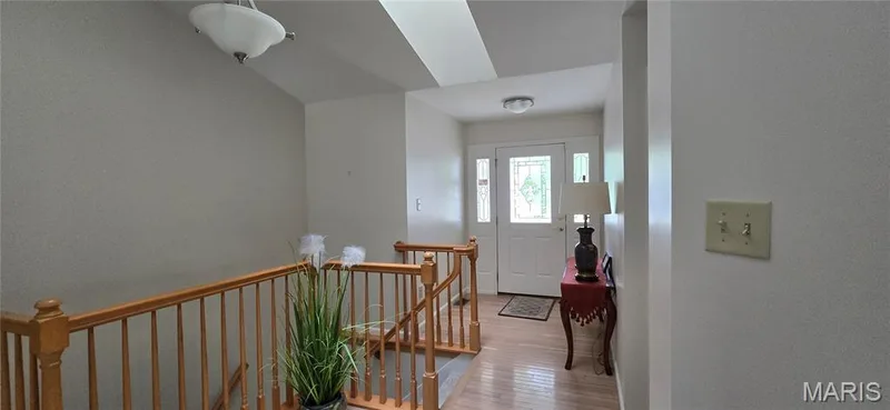 Lovely entry w soaring ceilings and open staircase greet you w  Fresh paint through out entire home along w all updated carpeting in 2025. — 30 Sterling Pointe Drive #22A, St Charles, MO 63301