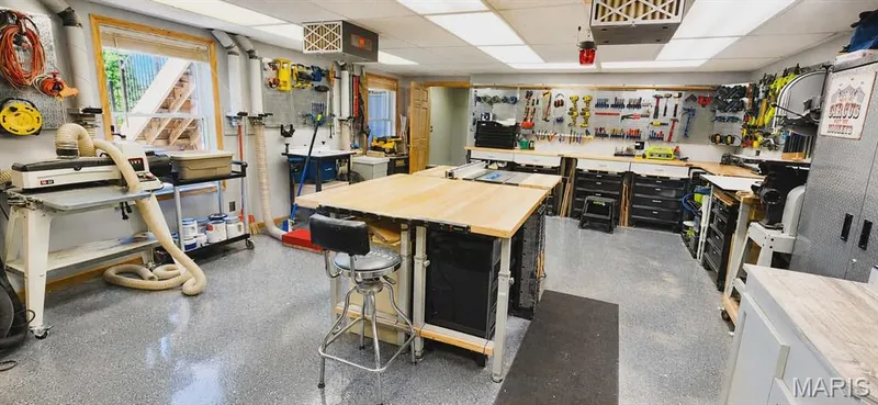 This is an amazing multipurpose room currently being used for a shop. — 535 Garrick Place, O'Fallon, MO 63368