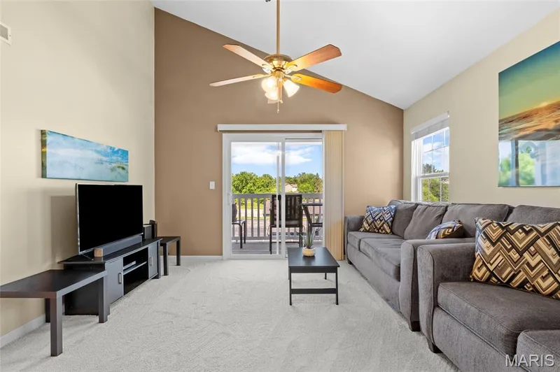 family room with vaulted ceiling and fan — 1233 Saravalle Drive, St Peters, MO 63376