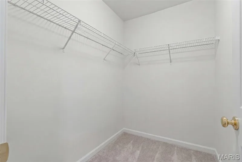 Walk in closet in primary bedroom — 1233 Saravalle Drive, St Peters, MO 63376