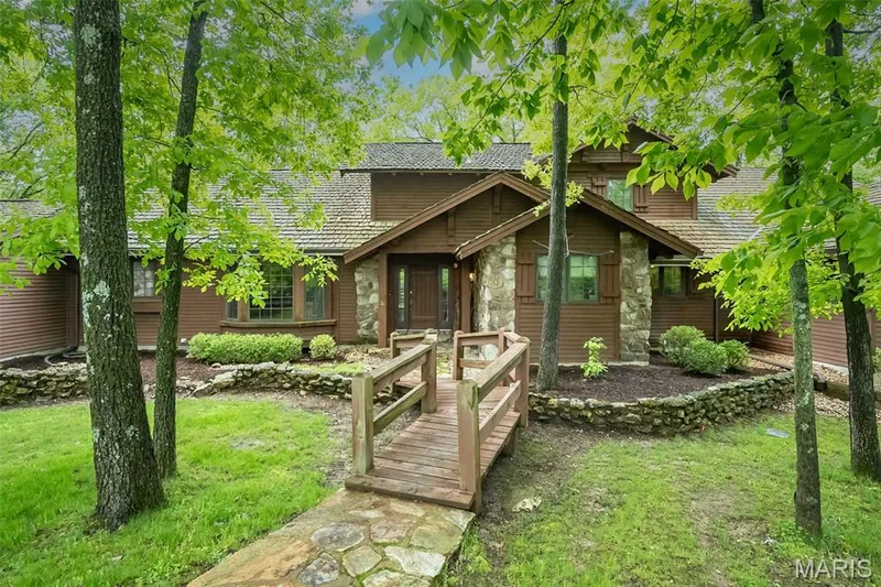 View of front of home featuring stone siding and a front lawn — 2731 Christy Avenue, Wildwood, MO 63040