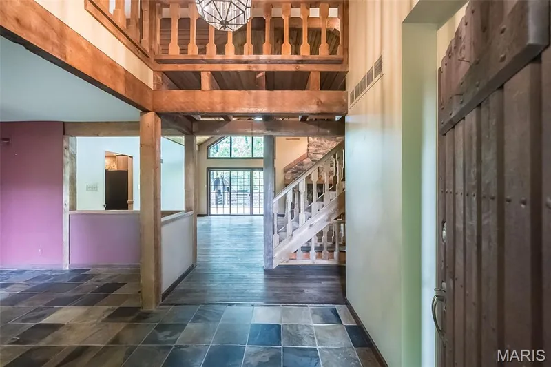 Entryway with stairs and stone finish flooring — 2731 Christy Avenue, Wildwood, MO 63040