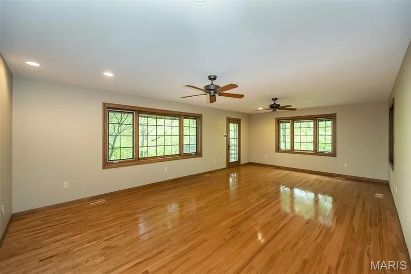 Spare room with light wood-style flooring, recessed lighting, a ceiling fan, and baseboards — 2731 Christy Avenue, Wildwood, MO 63040