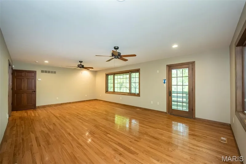 Empty room with light wood-style floors, a ceiling fan, recessed lighting, and baseboards — 2731 Christy Avenue, Wildwood, MO 63040