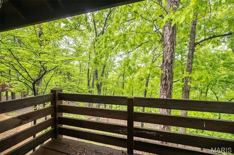 Wooden terrace featuring a view of trees — 2731 Christy Avenue, Wildwood, MO 63040