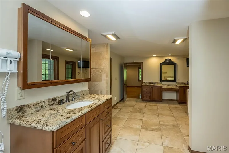 Full bath with two vanities, baseboards, tile patterned floors, and recessed lighting — 2731 Christy Avenue, Wildwood, MO 63040