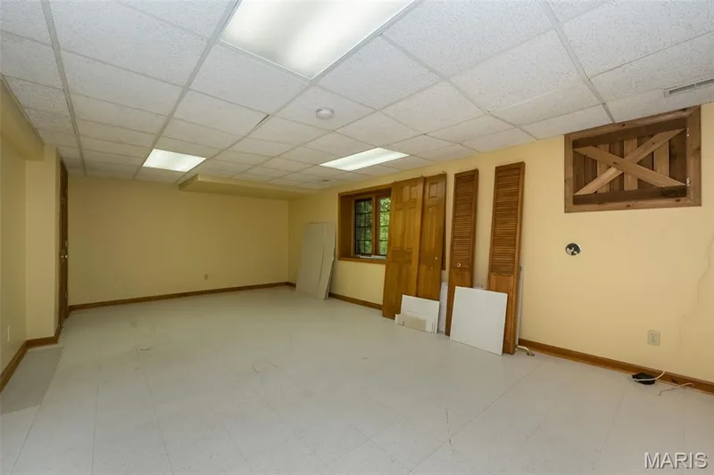 Unfurnished room with a drop ceiling and baseboards — 2731 Christy Avenue, Wildwood, MO 63040