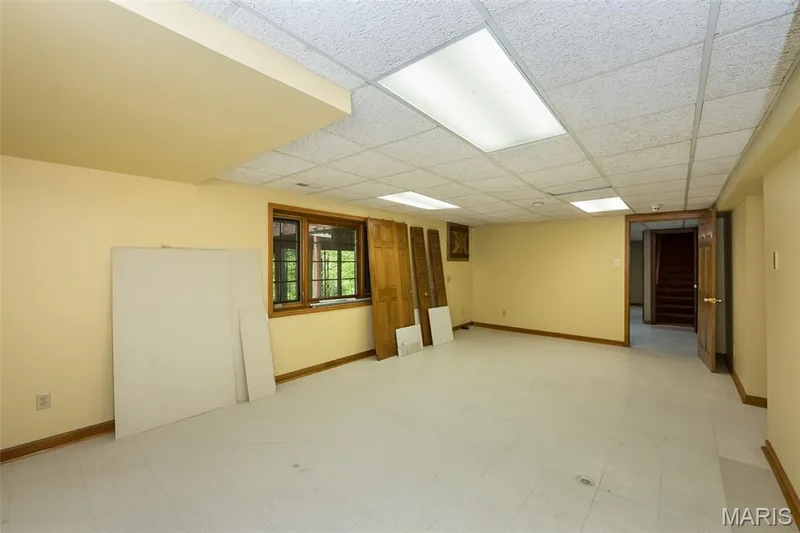 Spare room with a paneled ceiling and baseboards — 2731 Christy Avenue, Wildwood, MO 63040