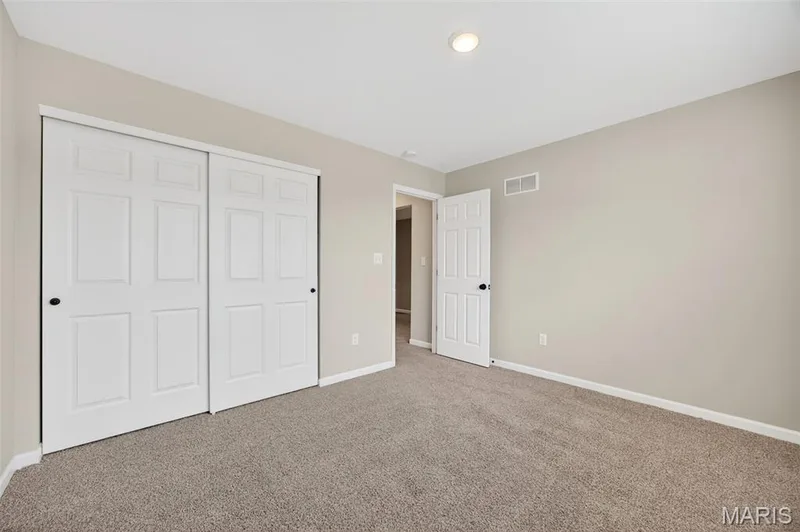 Neutral tone walls complement the light-colored carpeting — 112 Creek Haven Court, Lake St. Louis, MO 63367