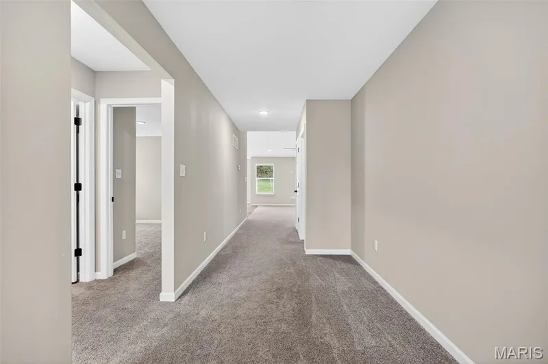 Hallway featuring neutral-toned walls, gray carpeting, white trim, and recessed lighting — 112 Creek Haven Court, Lake St. Louis, MO 63367