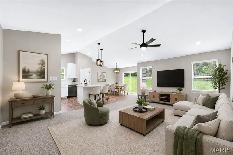 Open-concept living area featuring a vaulted ceiling with recessed lighting and a ceiling fan — 112 Creek Haven Court, Lake St. Louis, MO 63367