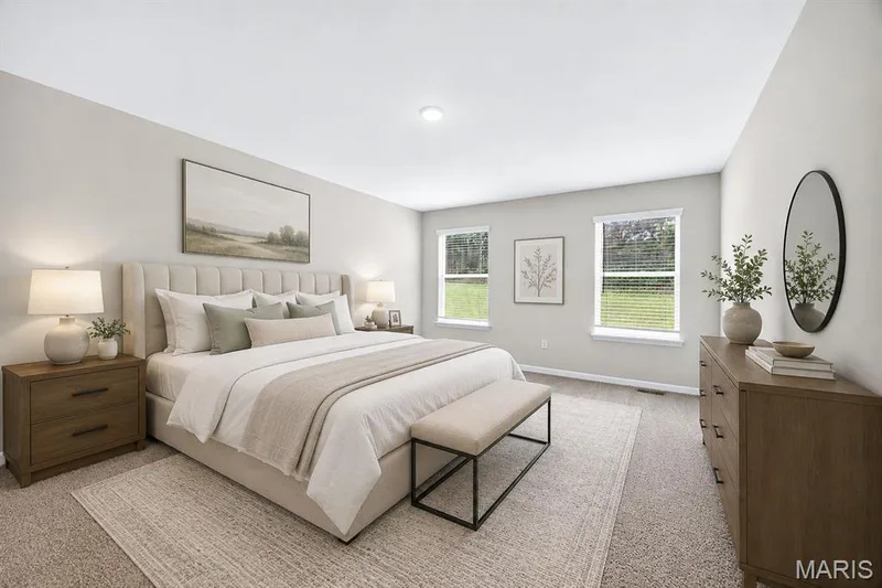Spacious room featuring light-colored walls and carpeted flooring — 112 Creek Haven Court, Lake St. Louis, MO 63367