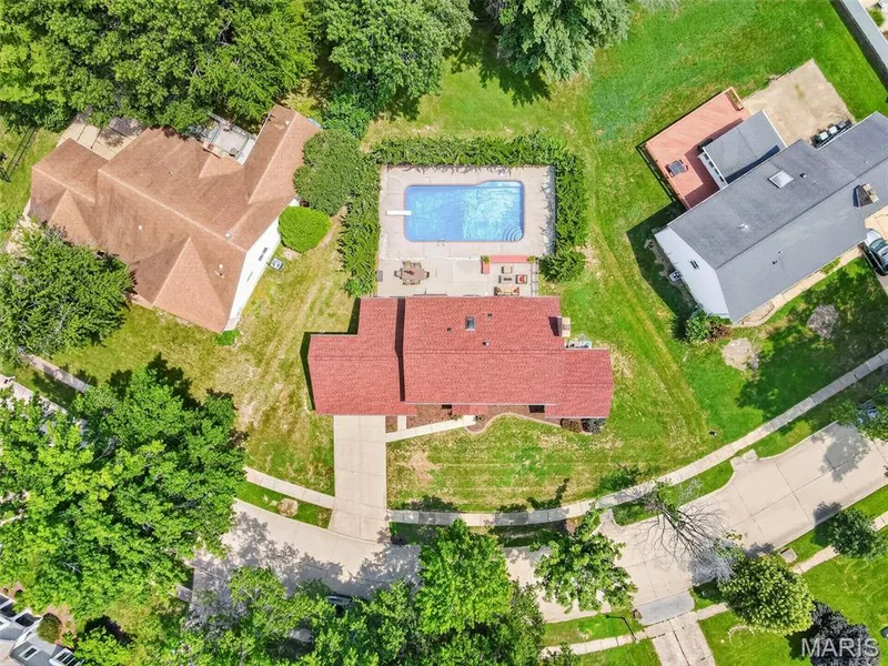 Note how there is grassy space beyond the pool in the backyard. — 2024 Meadowbrook Way Drive, Chesterfield, MO 63017