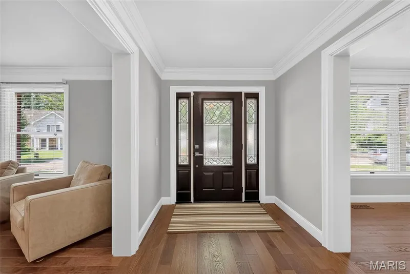 Step inside to beautiful, rich wood floors which run throughout nearly all the main floor. — 2024 Meadowbrook Way Drive, Chesterfield, MO 63017