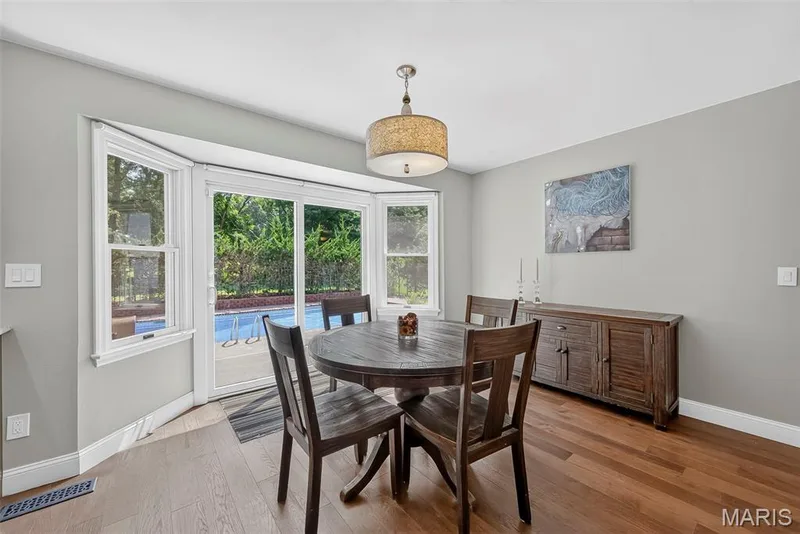 Eat-in kitchen at the bay window/door to the patio and pool. — 2024 Meadowbrook Way Drive, Chesterfield, MO 63017