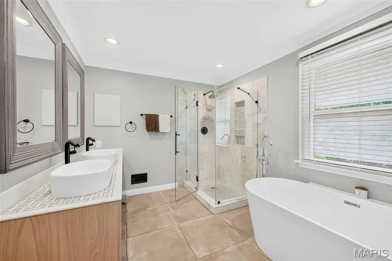 Fabulous primary bathroom suite with soaking tub, walk-in shower with glass surround, and double sinks. — 2024 Meadowbrook Way Drive, Chesterfield, MO 63017