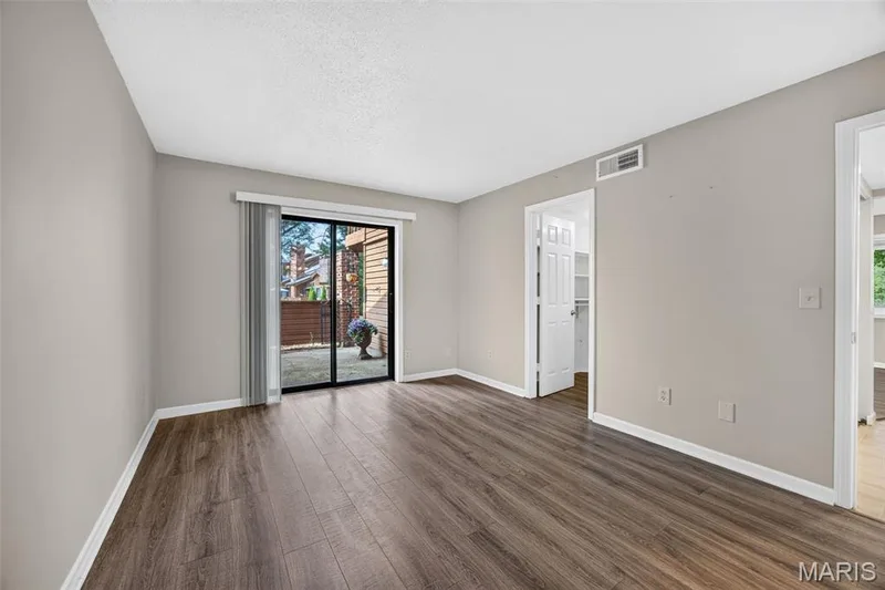 Bedroom w/ sliding door to Private Patio. — 408 Kipling Way #A, Weldon Spring, MO 63304
