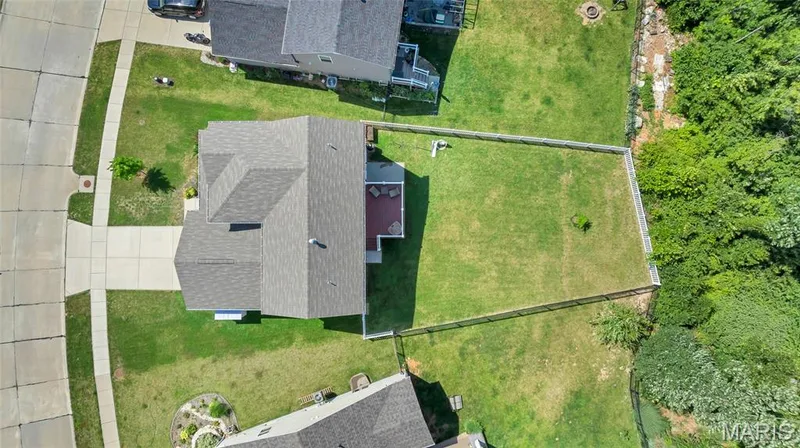 Fully fenced back yard with wooded common ground in back — 425 Dusty Brook Drive, O'Fallon, MO 63366