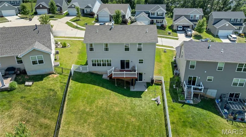 Aerial view of back of property fully fenced with maintenance free deck off breakfast room — 425 Dusty Brook Drive, O'Fallon, MO 63366